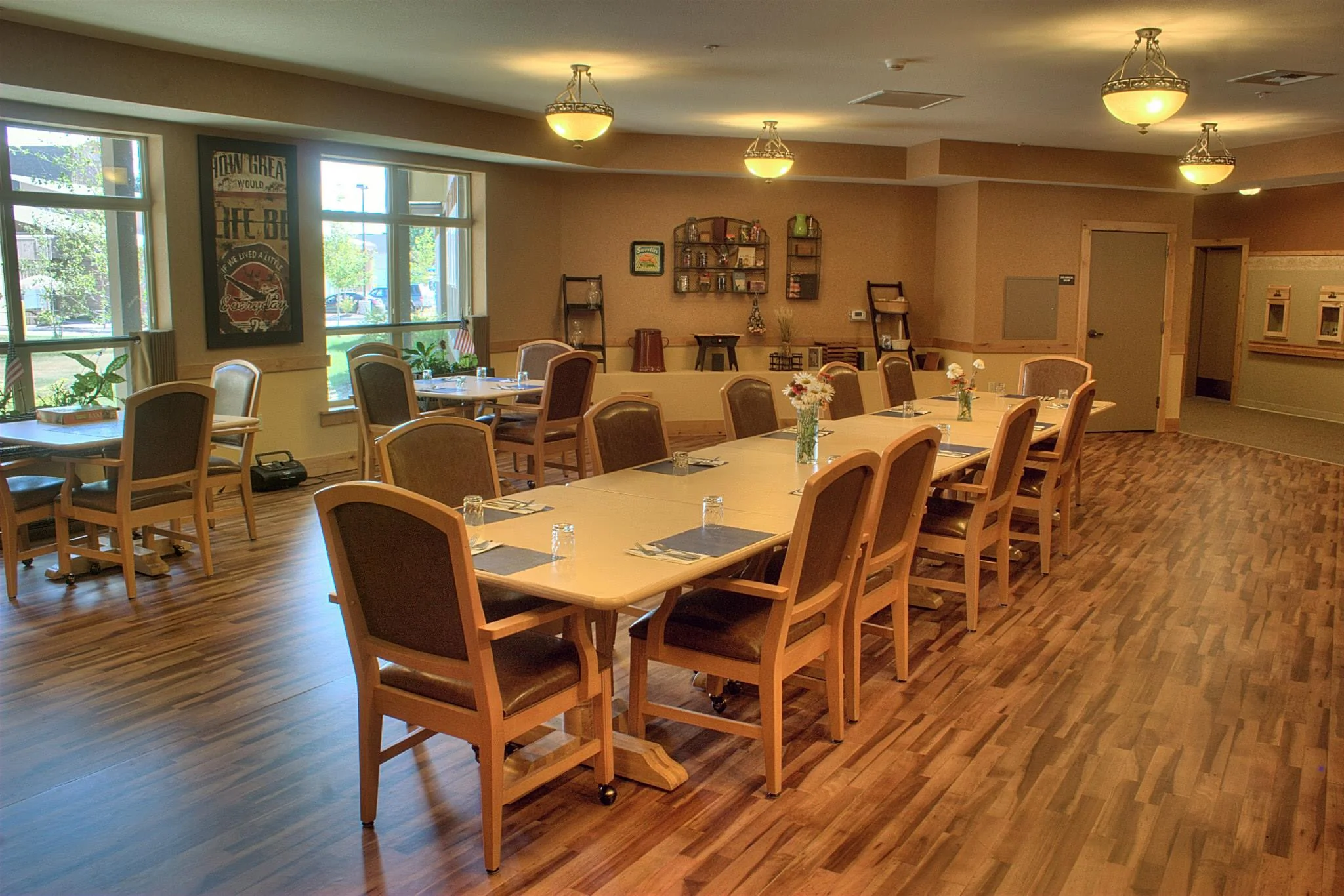 A long dining table in the center of a well-lit room