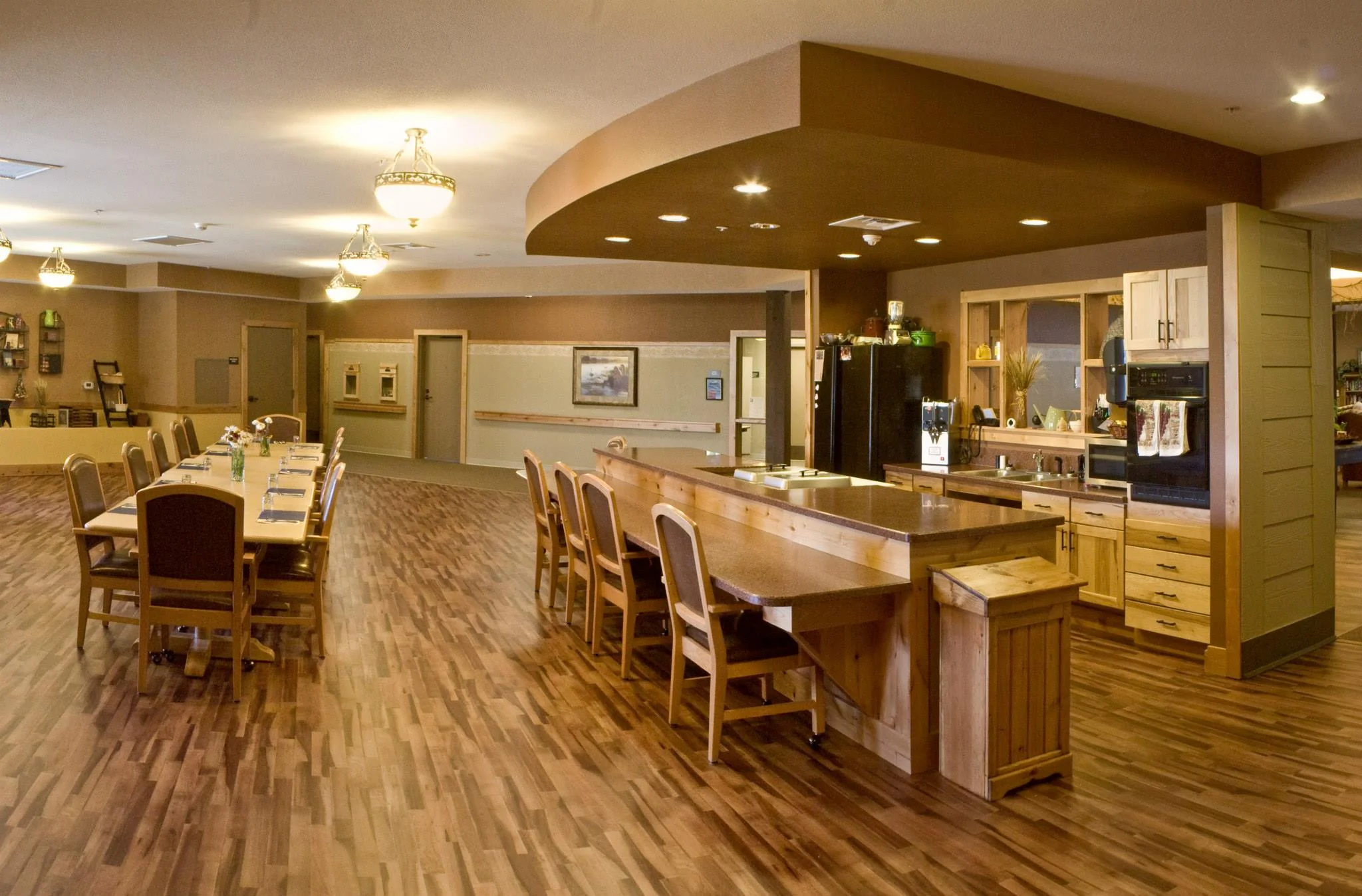 A bar next to a long dining table