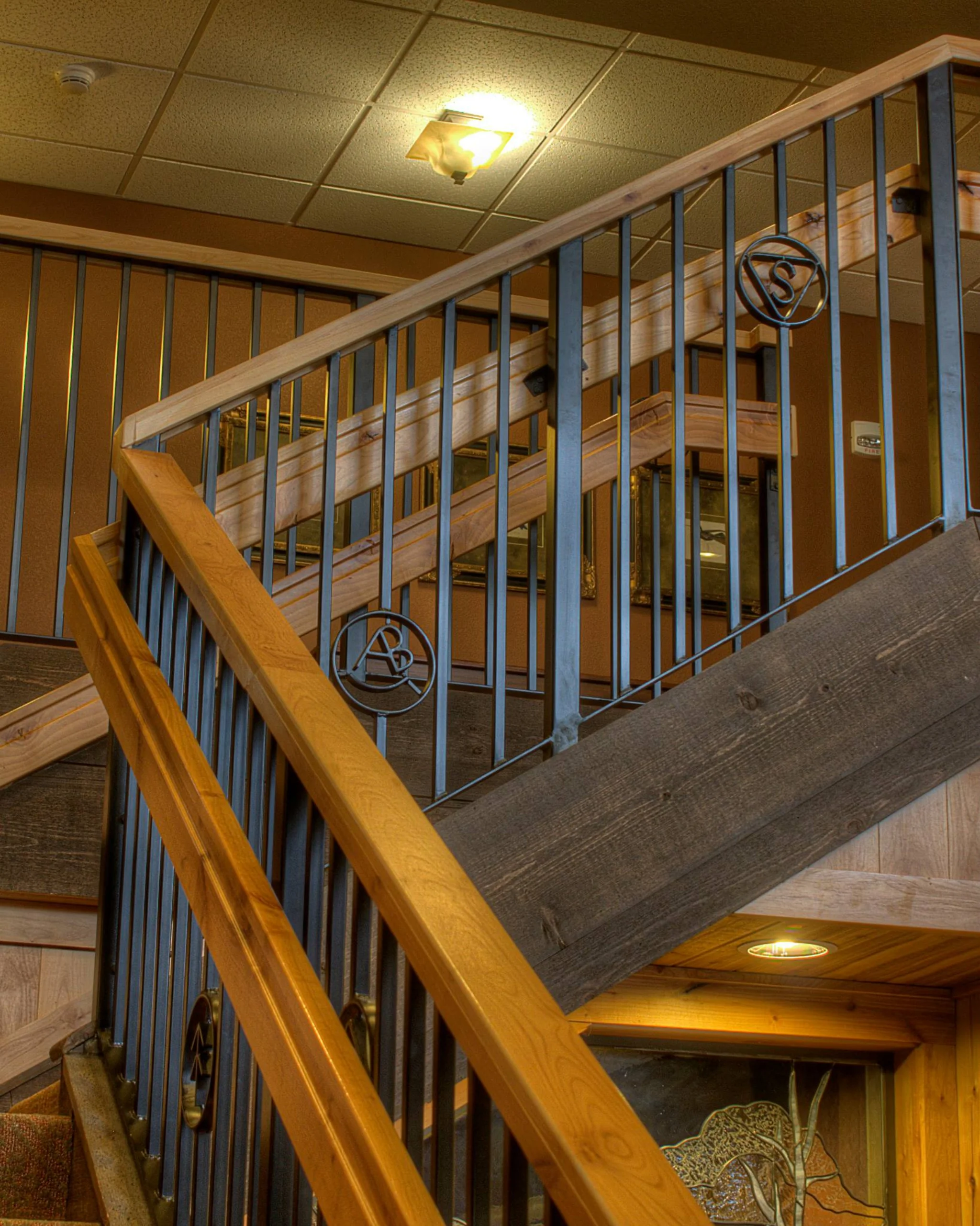 A staircase with wrought iron railing