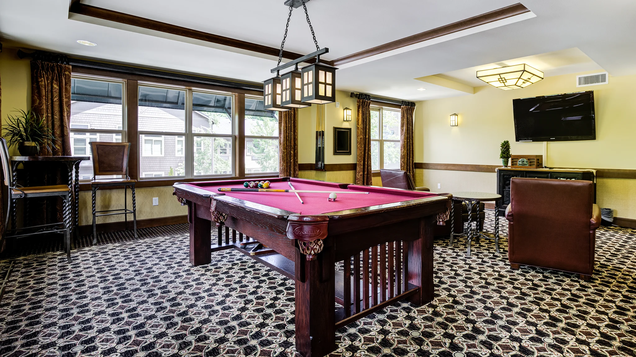 Pool table, TV, and various seating options