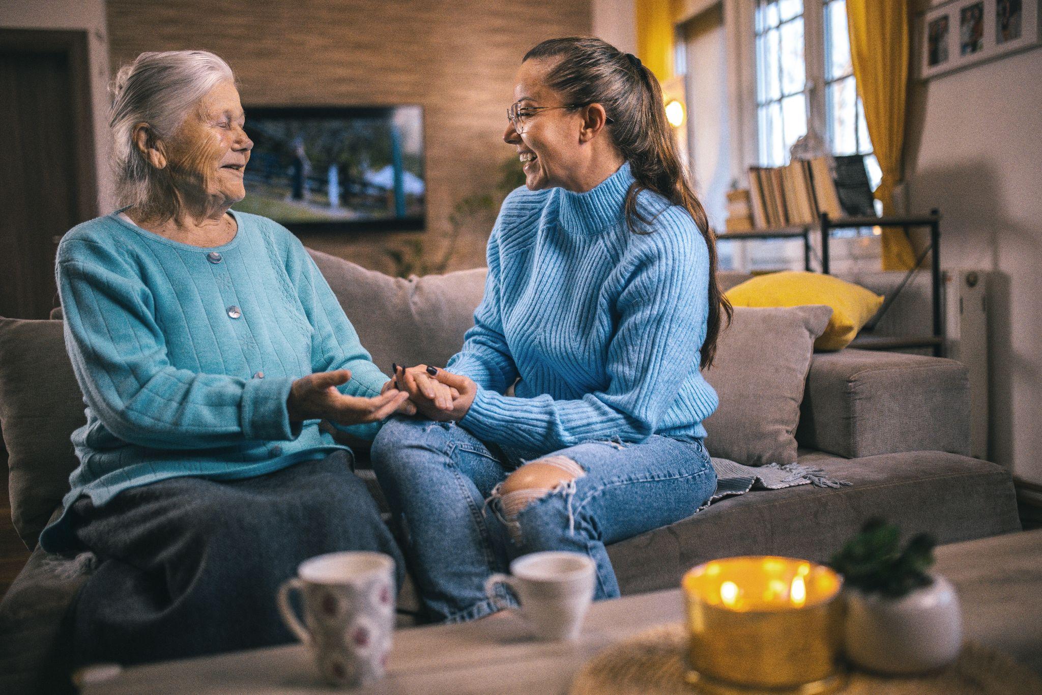 Older adults talking to each other over a cup of tea